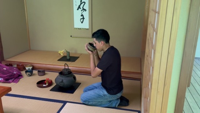 A student drinking tea