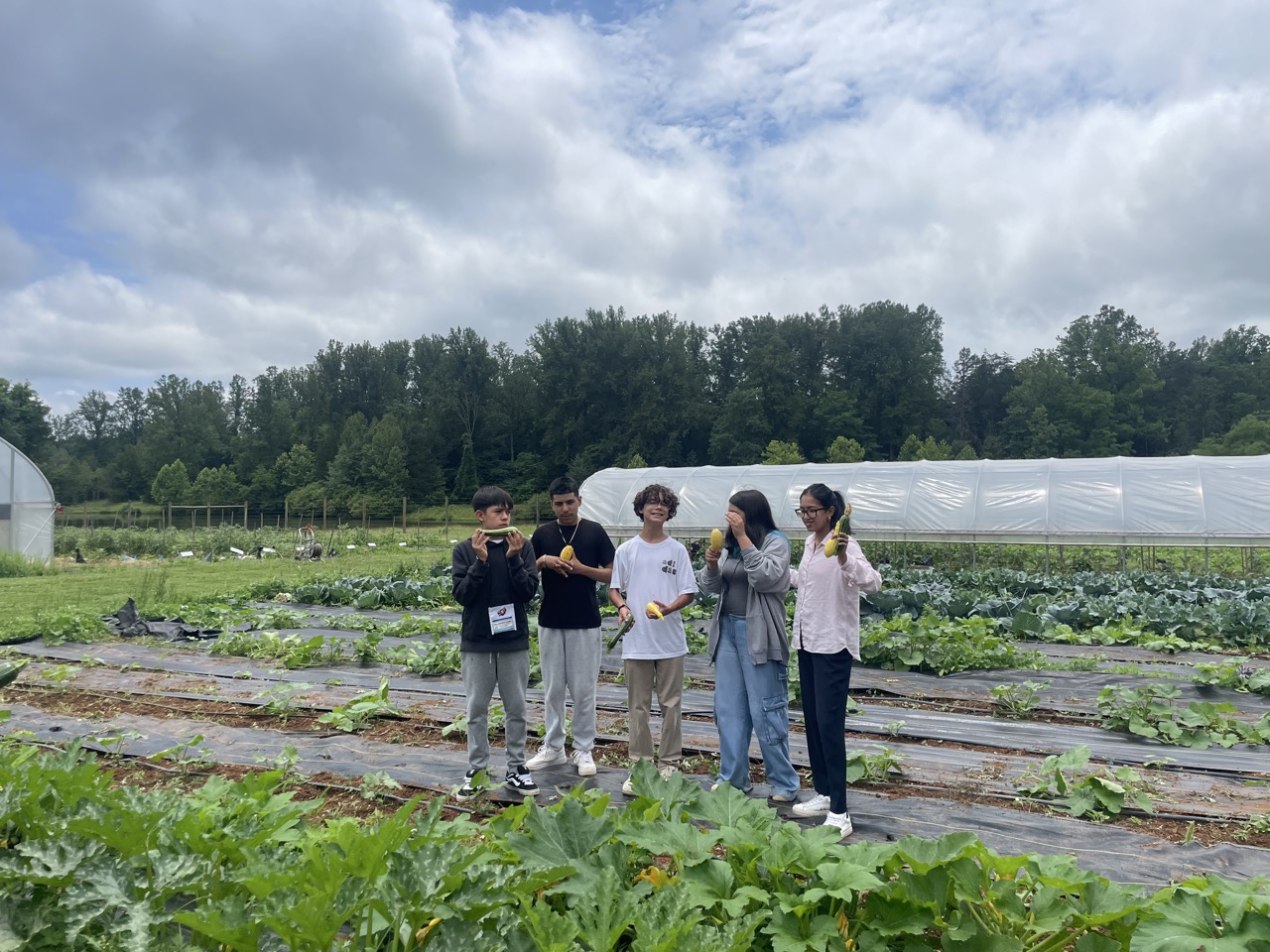 Students holding squash