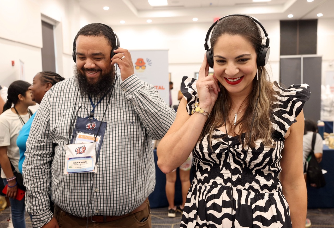 Staff listening to headphones